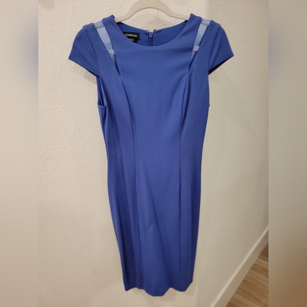 Bebe form fitting dress with cutouts